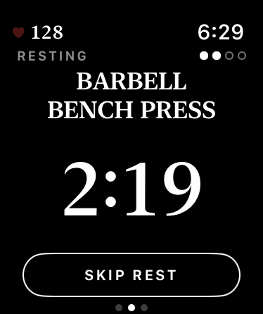 Resting on the watch: Barbell Bench Press over a countdown at 2:19 and a Skip Rest button.